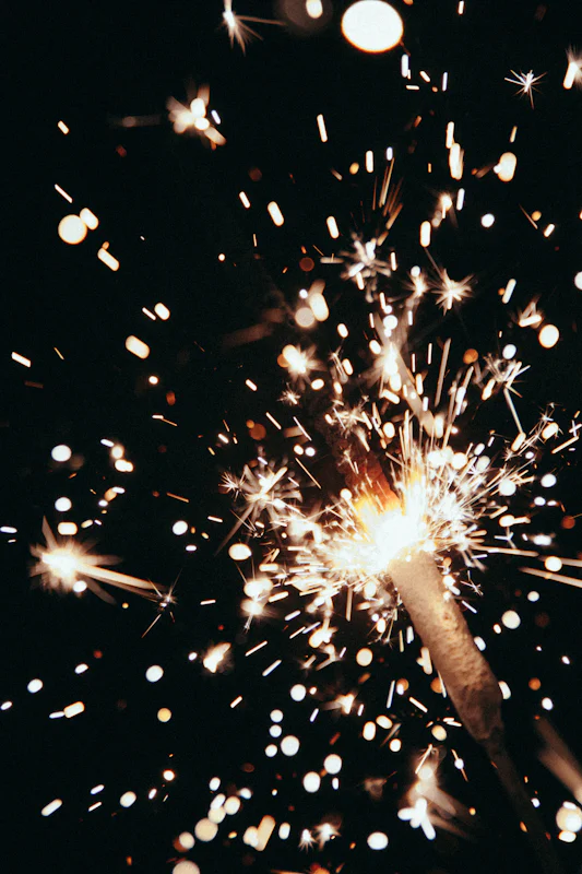 Sparkler throwing golden sparks